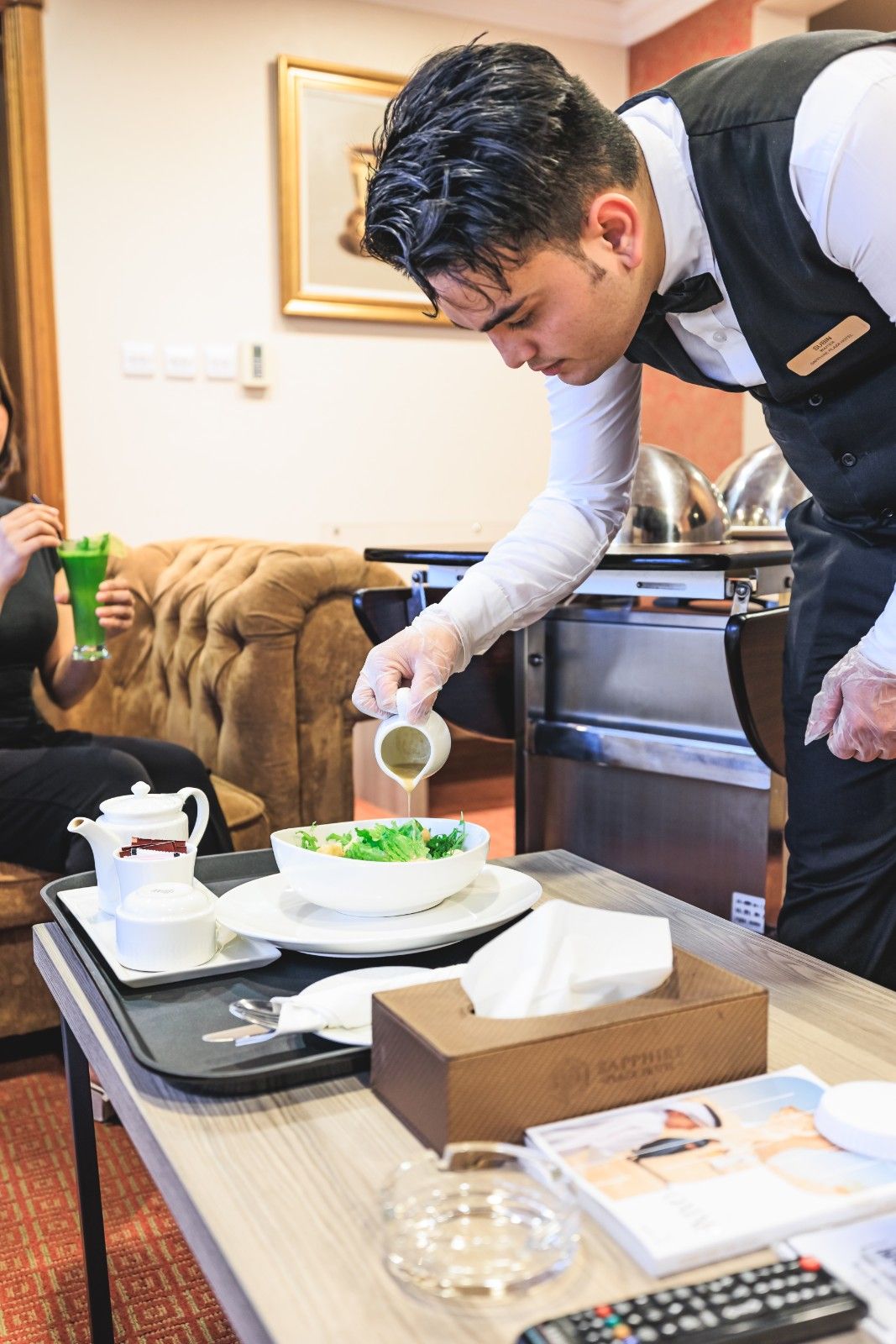 Professional room service serving fresh salad and breakfast at Sapphire Plaza Hotel Doha