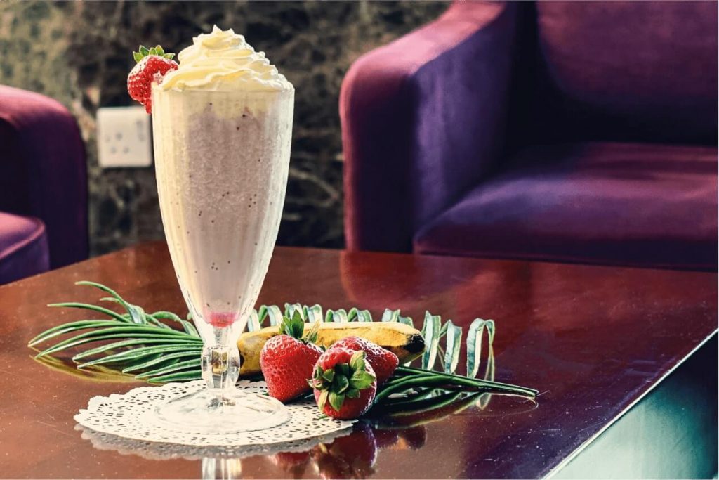 Delicious strawberry milkshake with whipped cream served at Sapphire Café in Sapphire Plaza Hotel Doha